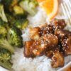 Orange Tofu in bowl with broccoli and white rice