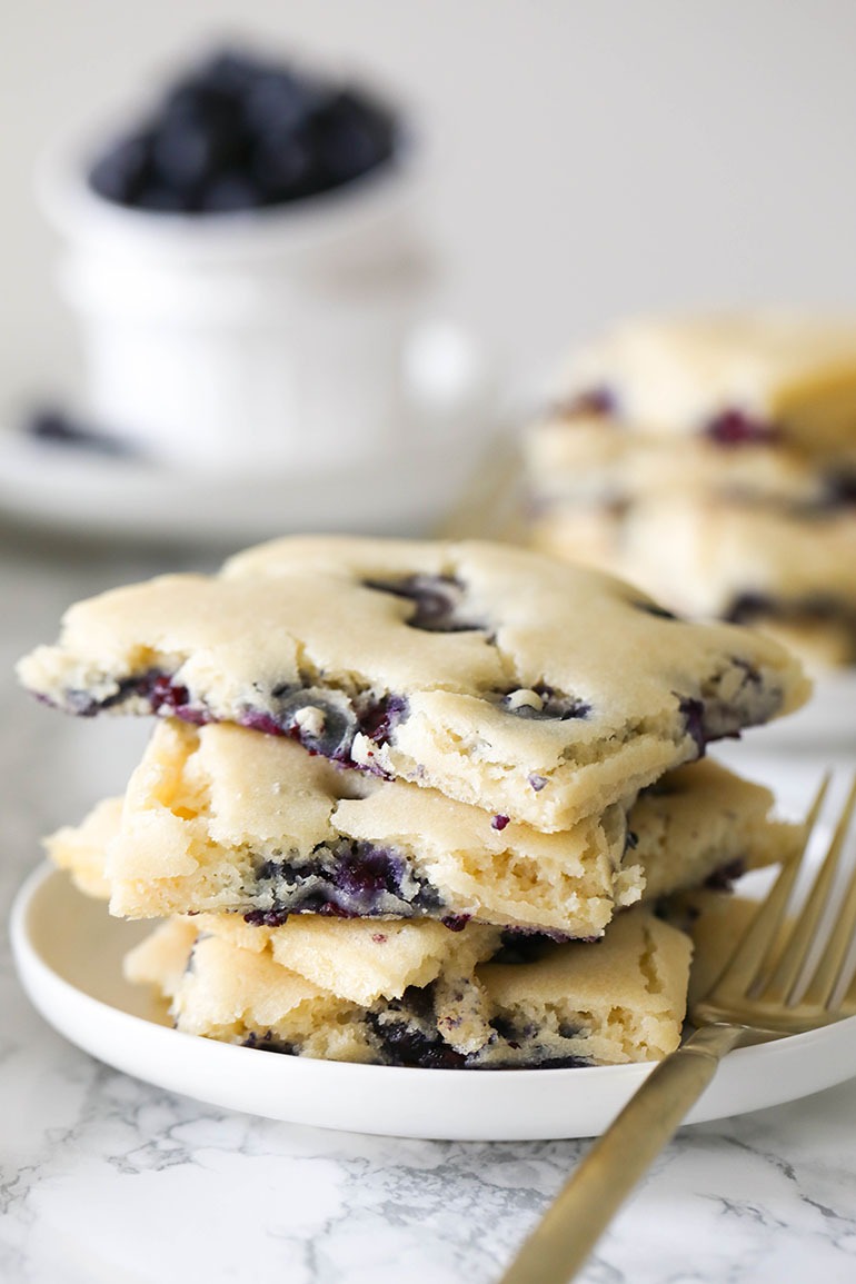Vegan Blueberry Sheet Pan Pancakes stack on white plate