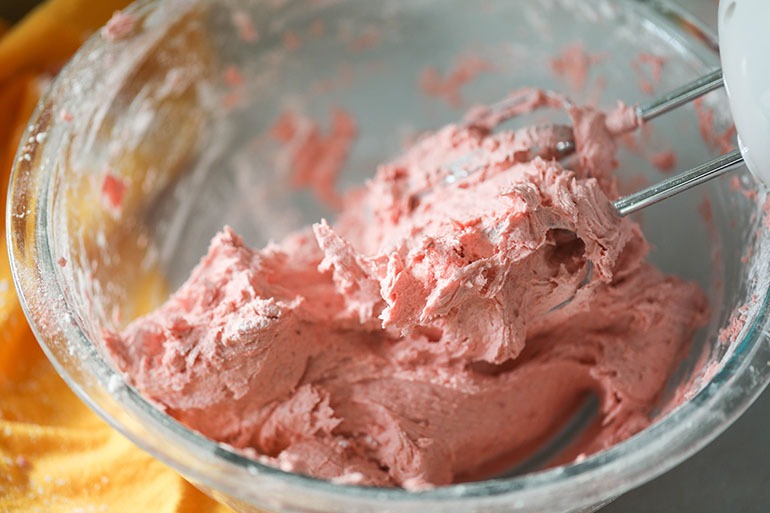 Vegan Strawberry buttercream frosting in mixing bowl