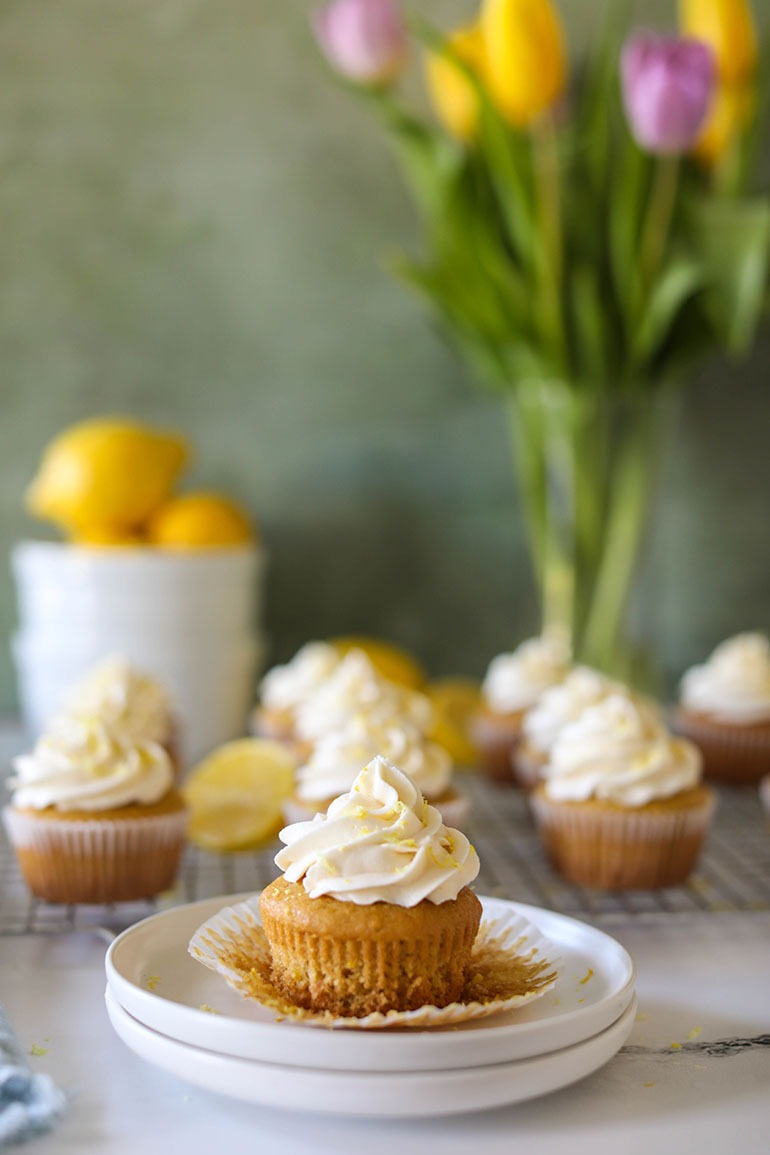 Vegan Lemon Cupcakes on wire cooling rack and small white plates