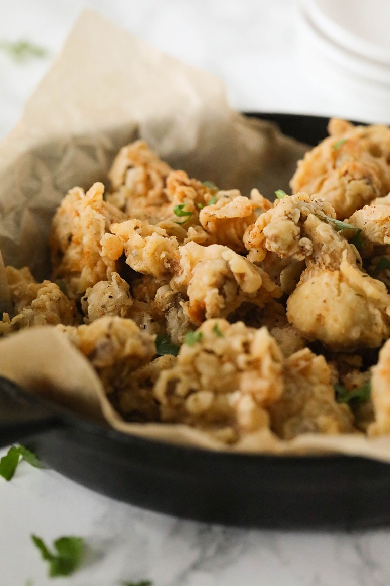 Fried Oyster Mushrooms in black pan