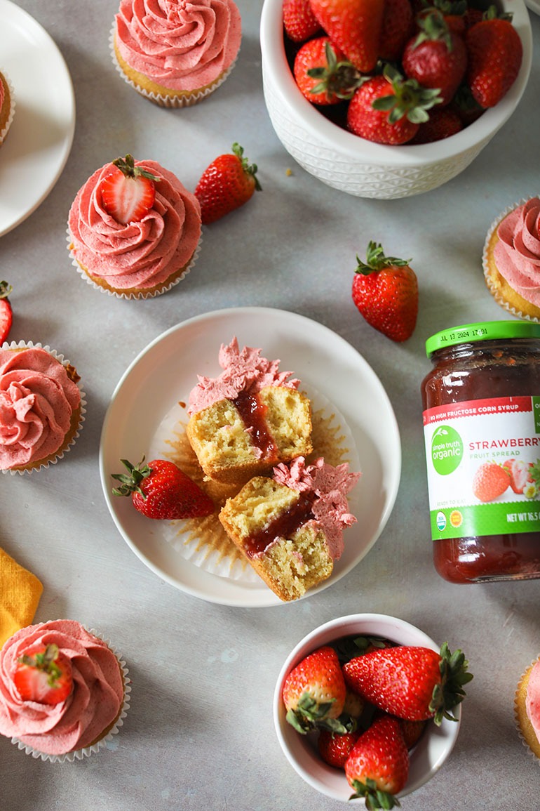 Vegan Strawberry Cupcake cut in half with strawberry filling