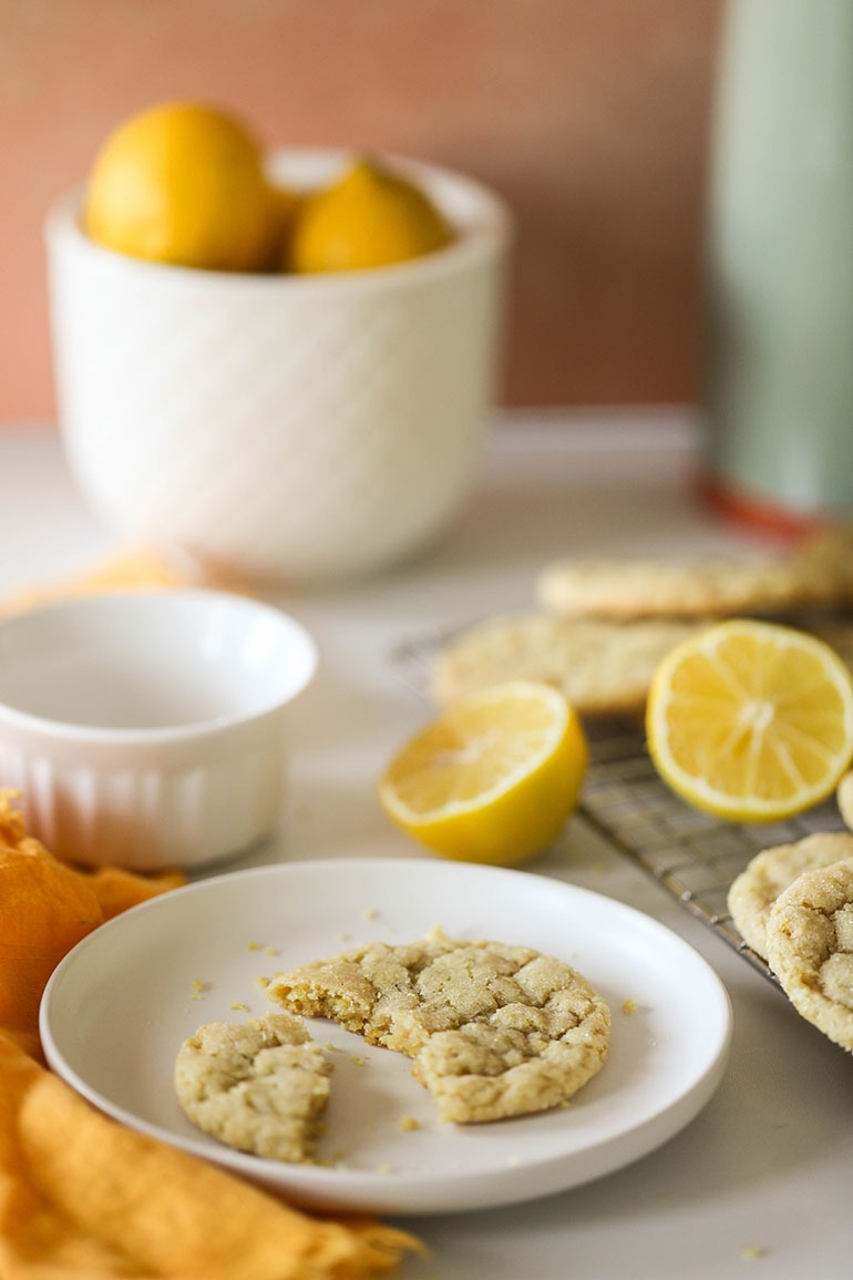 Vegan Lemon Sugar Cookies on a cooling rack and small white plate
