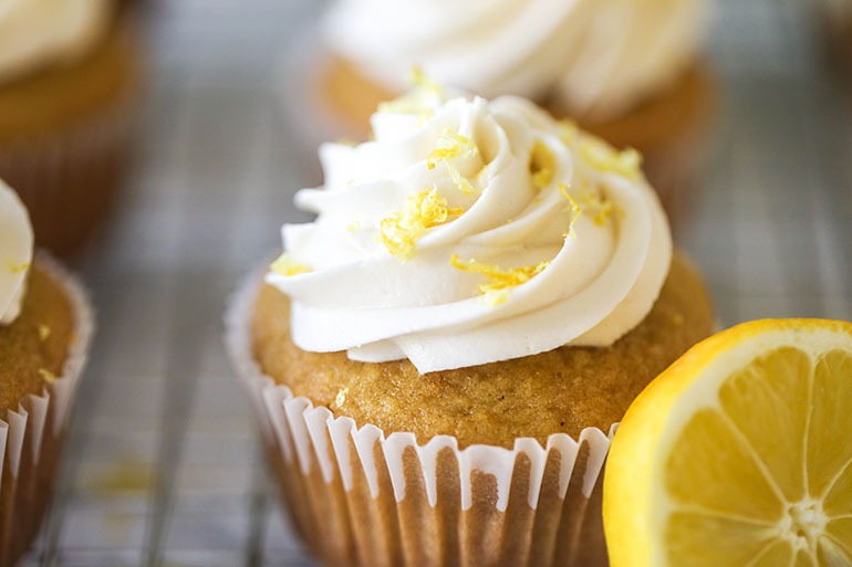 Closeup of Vegan Lemon Cupcakes on wire cooling rack