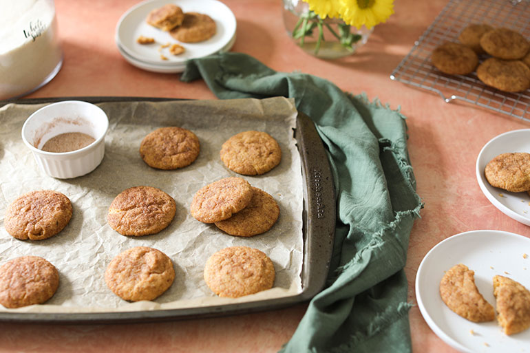 Vegan Pumpkin Snickerdoodle Cookies on baking sheet