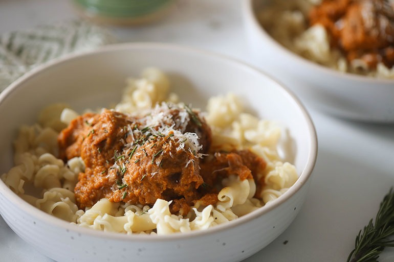 Vegan Pumpkin Meatball Pasta in flat white bowls