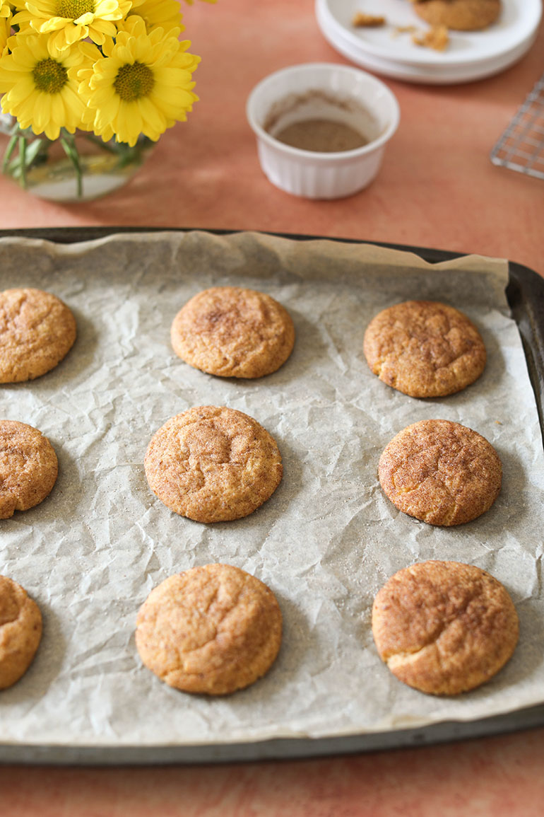 Vegan Pumpkin Snickerdoodle Cookies on a baking sheet