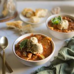 Vegan Vegetable Lasagna Soup in two bowls with gold spoons